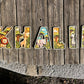 Prénom KHALIL en six lettres individuelles en bois imprimées, décorées d’animaux de la savane.