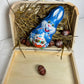 valise lapin de paque garnie de chocolat succulents